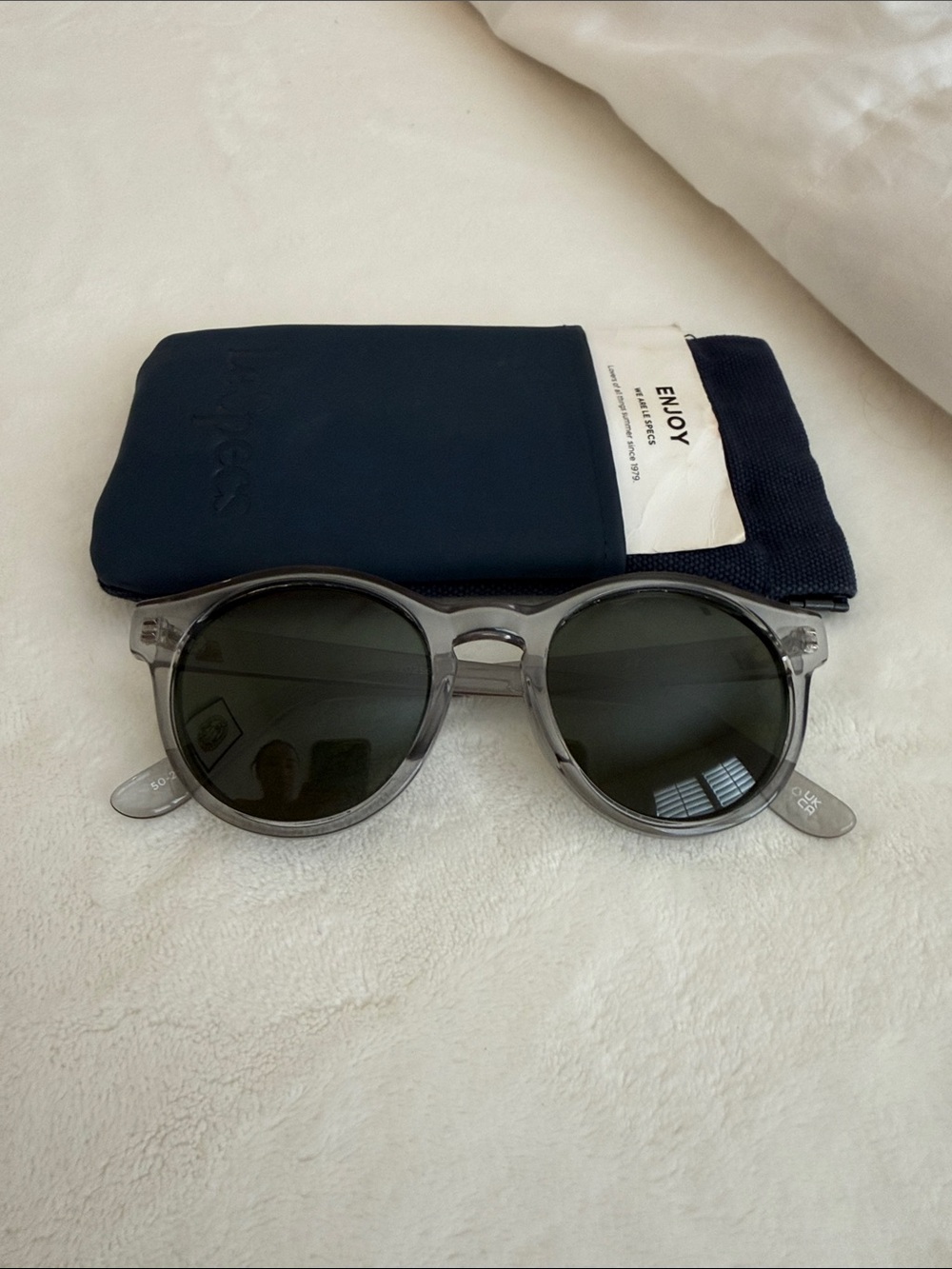 Le Specs Round Sunglasses in Translucent Gray Frames with Dark Green Lenses